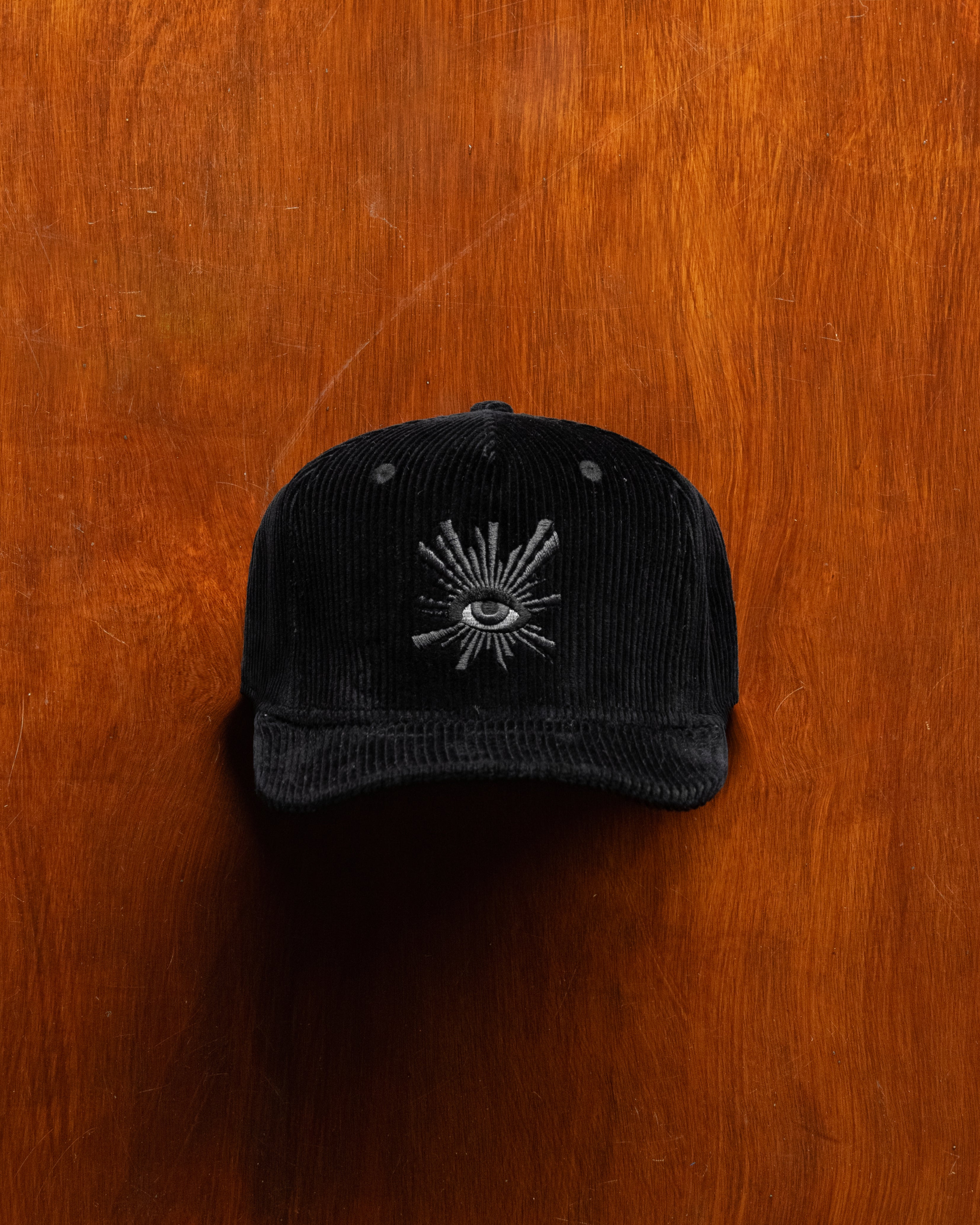 ALL-SEEING CORDUROY CAP IN BLACK